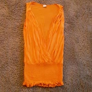 Orange vest-like top.